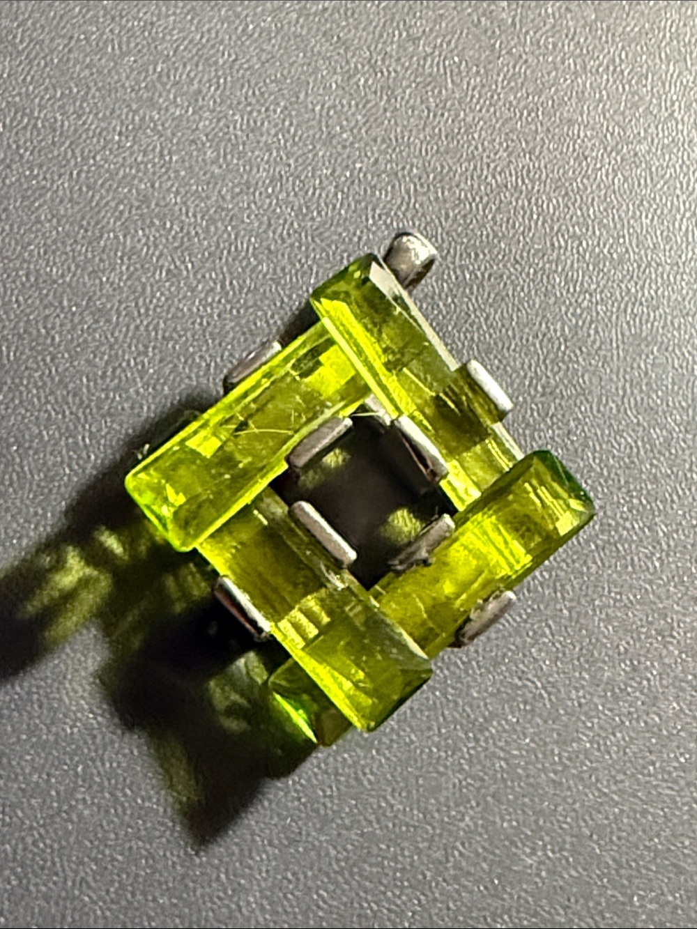 geometric pendant with vibrant peridot green glass set in 925